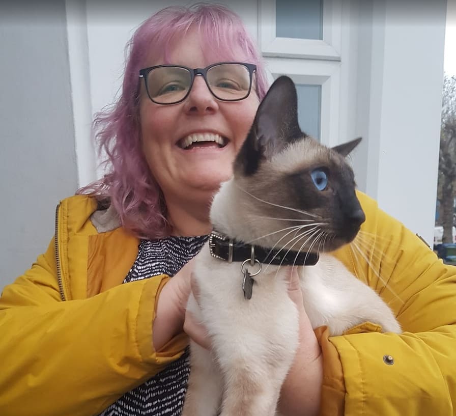 Michelle with a siamese cat
